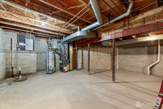 basement featuring electric panel, gas water heater, and heating unit