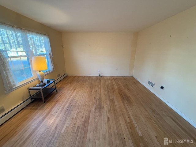 empty room featuring hardwood / wood-style flooring