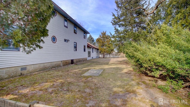 view of property exterior with crawl space