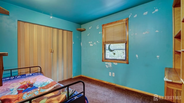 carpeted bedroom featuring baseboards