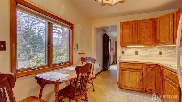 dining area featuring light tile patterned floors and plenty of natural light