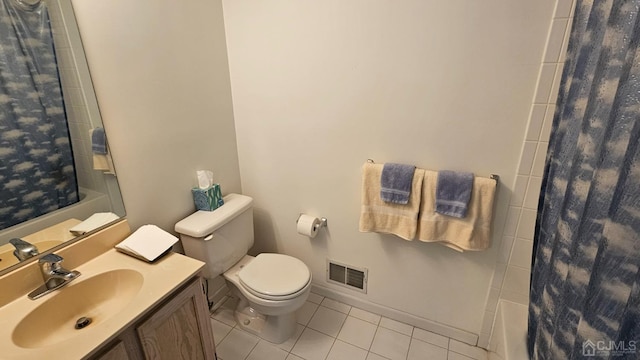 bathroom featuring toilet, tile patterned floors, and vanity