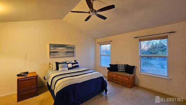 carpeted bedroom with ceiling fan and lofted ceiling