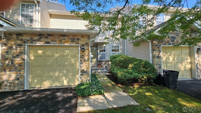 view of front of property with a garage