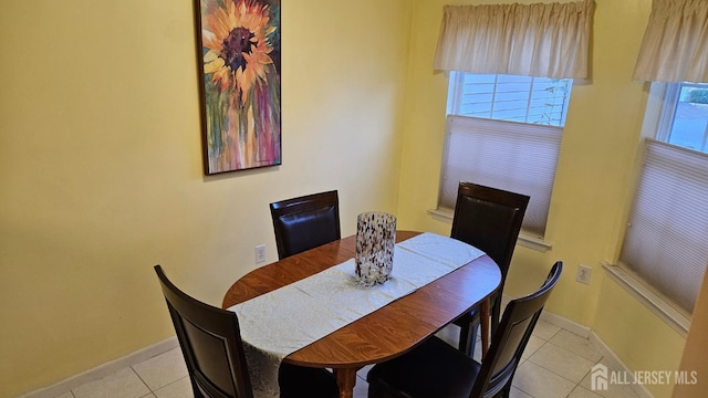 dining area featuring a wealth of natural light and light tile patterned flooring