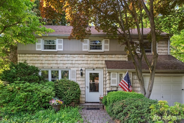 22 S Drive E, Brunswick, NJ 08816 - view of front of home with a garage and a shingled roof