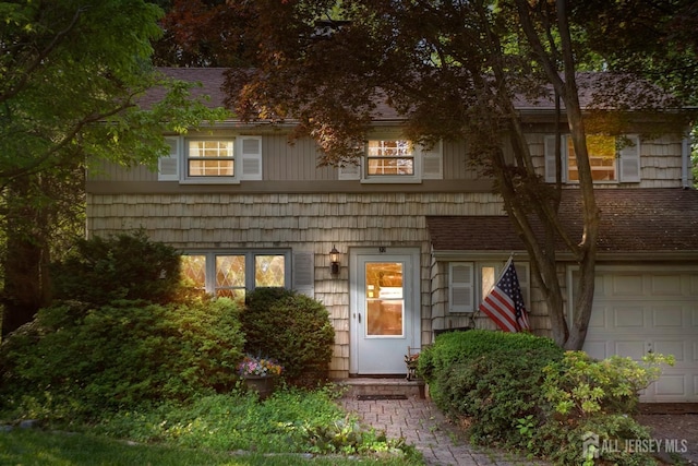 22 S Drive E, Brunswick, NJ 08816 - view of front of property featuring an attached garage and roof with shingles