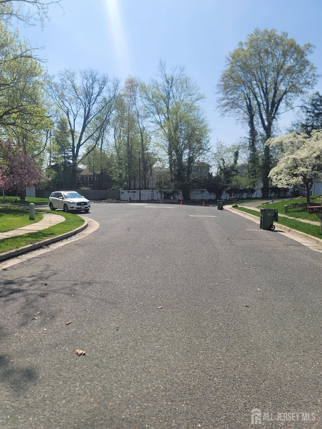 10 Ginesi Ct, Metuchen, NJ 08840 - view of asphalt street featuring curbs and sidewalks