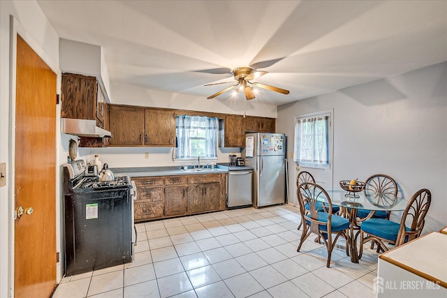 10 Ginesi Ct, Metuchen, NJ 08840 - kitchen featuring stainless steel appliances, under cabinet range hood, a ceiling fan, light tile patterned flooring, and brown cabinetry