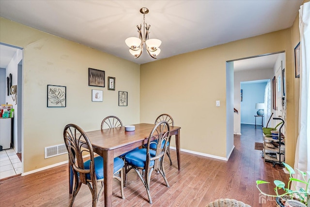 10 Ginesi Ct, Metuchen, NJ 08840 - dining area with a chandelier and wood finished floors