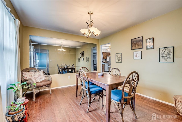 10 Ginesi Ct, Metuchen, NJ 08840 - dining room with a chandelier and wood finished floors