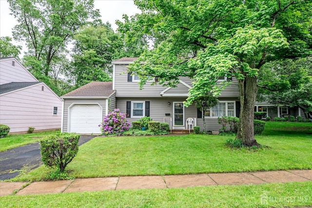 10 Ginesi Ct, Metuchen, NJ 08840 - view of front of property featuring an attached garage, driveway, a front lawn, and roof with shingles