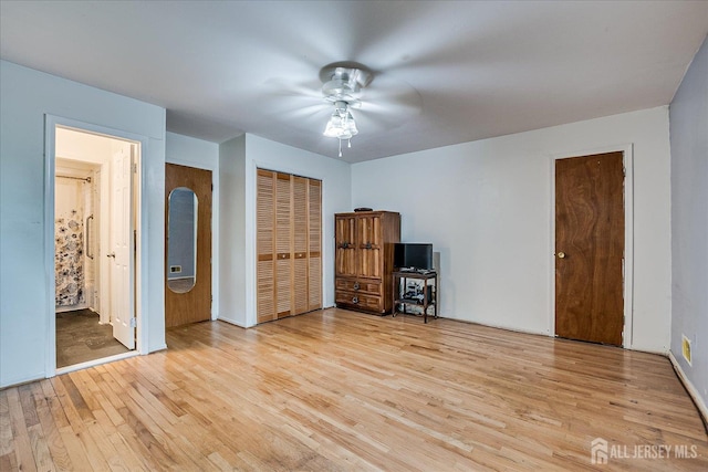 10 Ginesi Ct, Metuchen, NJ 08840 - unfurnished bedroom featuring wood finished floors, ensuite bathroom, and ceiling fan