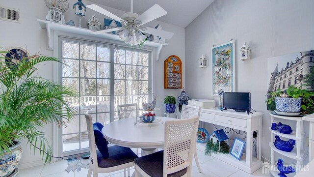 tiled dining room with ceiling fan