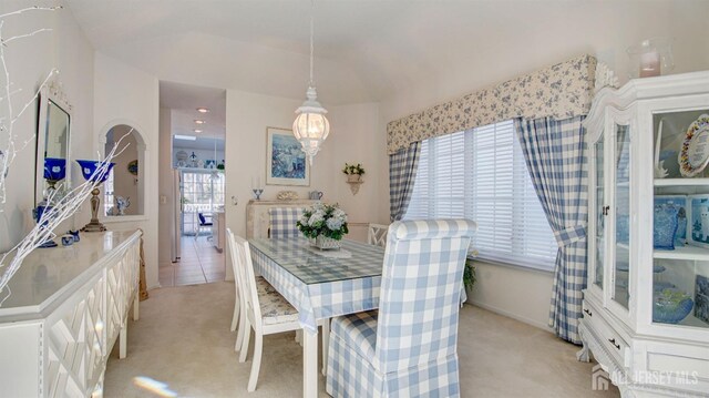 dining space with light carpet