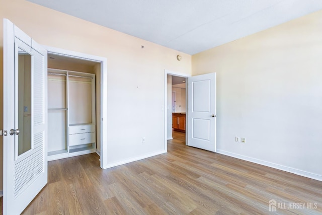 20 Livingston Ave Unit 504, New Brunswick, NJ 08901 - unfurnished bedroom with wood finished floors and a closet