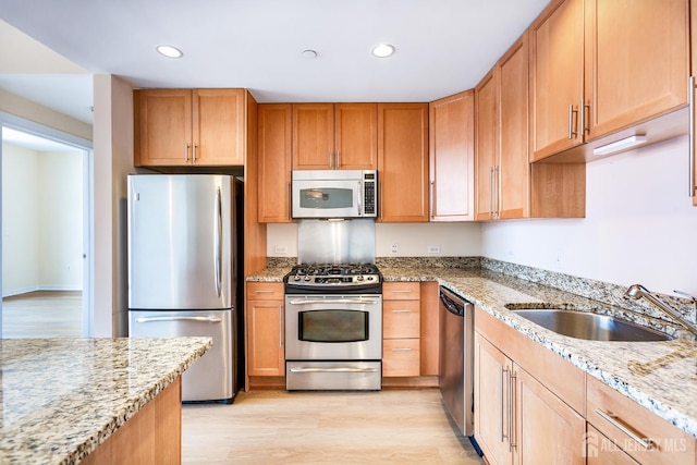 20 Livingston Ave Unit 504, New Brunswick, NJ 08901 - kitchen with appliances with stainless steel finishes, light wood finished floors, light stone counters, and recessed lighting