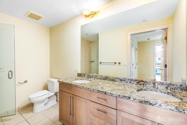 20 Livingston Ave Unit 504, New Brunswick, NJ 08901 - bathroom featuring double vanity, tile patterned flooring, and a shower stall