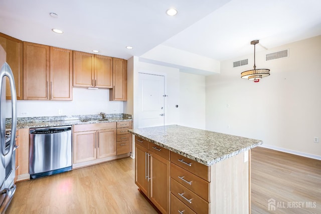 20 Livingston Ave Unit 504, New Brunswick, NJ 08901 - kitchen with appliances with stainless steel finishes, light wood-style floors, light stone countertops, recessed lighting, and pendant lighting