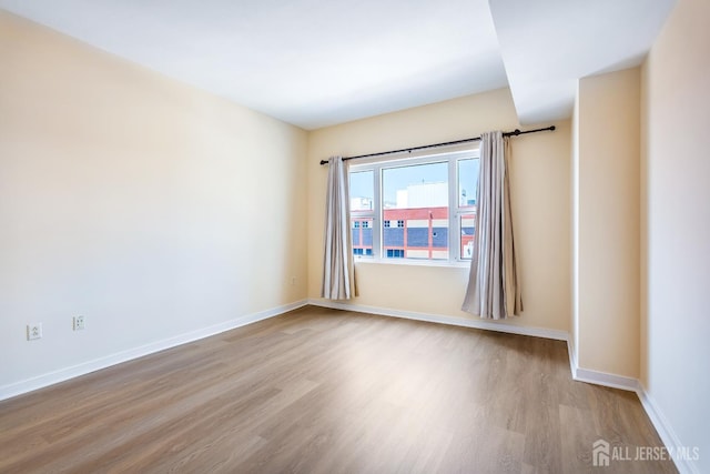 20 Livingston Ave Unit 504, New Brunswick, NJ 08901 - unfurnished room featuring wood finished floors and baseboards