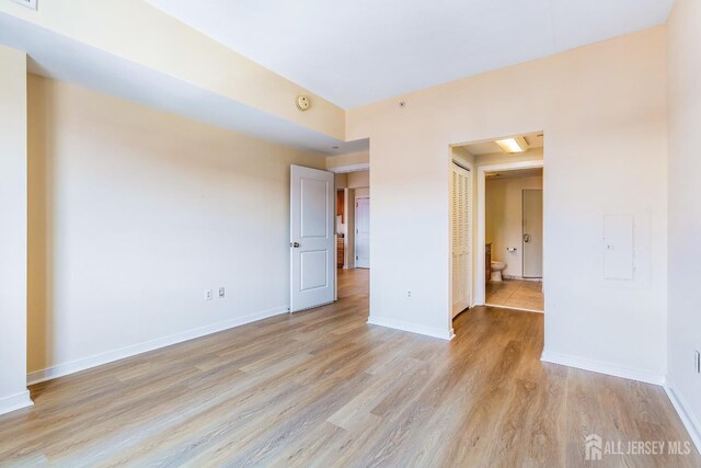 20 Livingston Ave Unit 504, New Brunswick, NJ 08901 - unfurnished room featuring light wood-style floors and a smoke detector