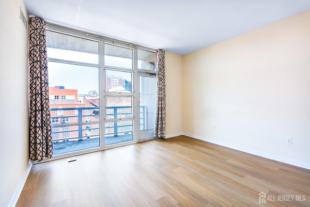 20 Livingston Ave Unit 504, New Brunswick, NJ 08901 - unfurnished room featuring wood finished floors and baseboards