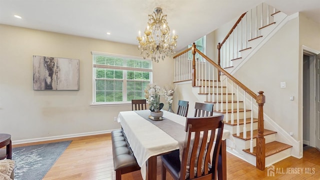 612 Magnolia Rd, North Brunswick, NJ 08902 - dining area featuring light wood-style floors, a chandelier, stairs, recessed lighting, and baseboards