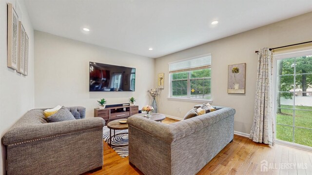 612 Magnolia Rd, North Brunswick, NJ 08902 - living area featuring wood finished floors, recessed lighting, and baseboards
