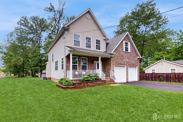 612 Magnolia Rd, North Brunswick, NJ 08902 - traditional-style house with a porch, asphalt driveway, stone siding, a garage, and cooling unit