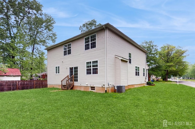 612 Magnolia Rd, North Brunswick, NJ 08902 - rear view of house featuring entry steps and central air condition unit