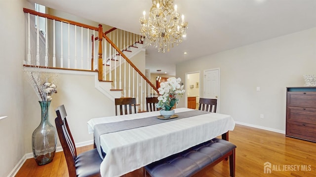 612 Magnolia Rd, North Brunswick, NJ 08902 - dining space with light wood-style flooring, stairway, baseboards, a chandelier, and recessed lighting