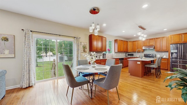 612 Magnolia Rd, North Brunswick, NJ 08902 - dining space with healthy amount of natural light, light wood-style flooring, recessed lighting, and baseboards