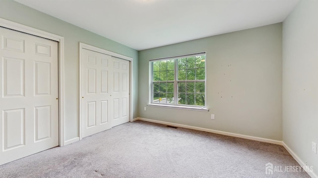 612 Magnolia Rd, North Brunswick, NJ 08902 - unfurnished bedroom with carpet, baseboards, and a closet