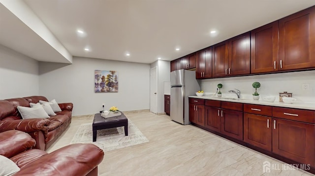 612 Magnolia Rd, North Brunswick, NJ 08902 - living room with recessed lighting and light marble finish floors
