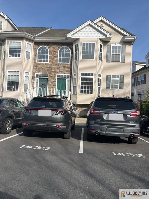 view of front of home with uncovered parking