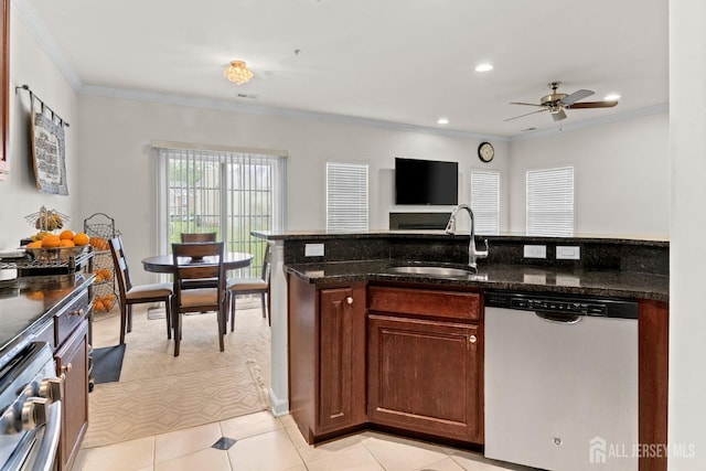 kitchen with stainless steel dishwasher, a sink, ornamental molding, ceiling fan, and dark stone counters