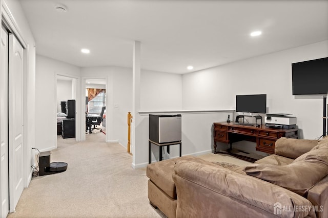 living area featuring light carpet, recessed lighting, and baseboards