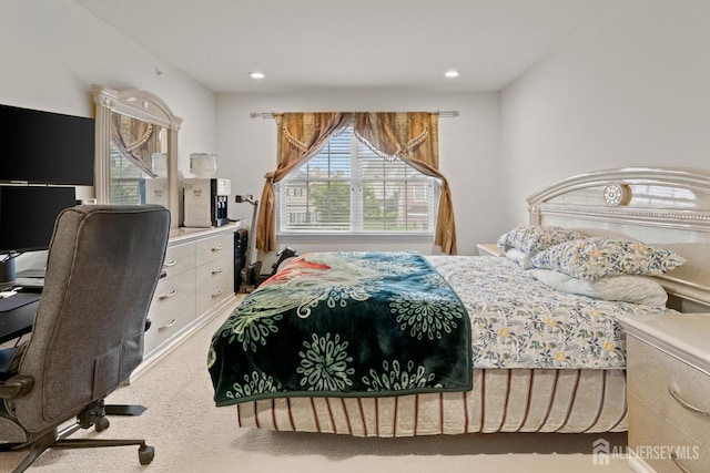 carpeted bedroom with a desk and recessed lighting
