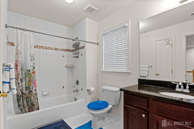 full bath featuring shower / bath combo, tile patterned floors, toilet, vanity, and baseboards