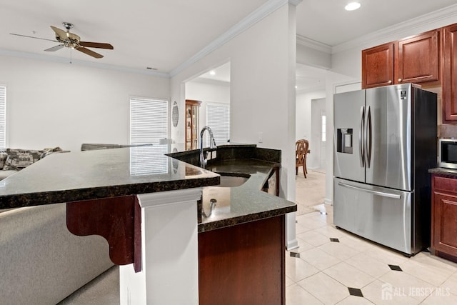 kitchen with stainless steel appliances, a sink, ceiling fan, crown molding, and light tile patterned flooring