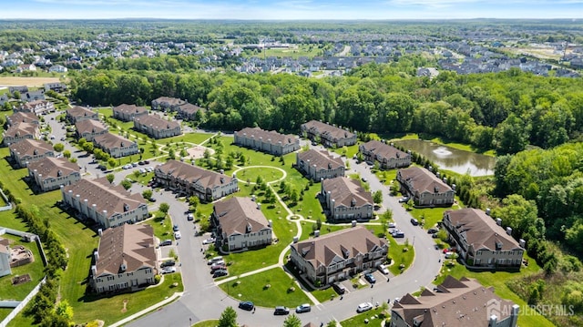 aerial perspective of suburban area featuring a large body of water