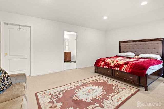 bedroom with carpet floors, recessed lighting, ensuite bath, and baseboards