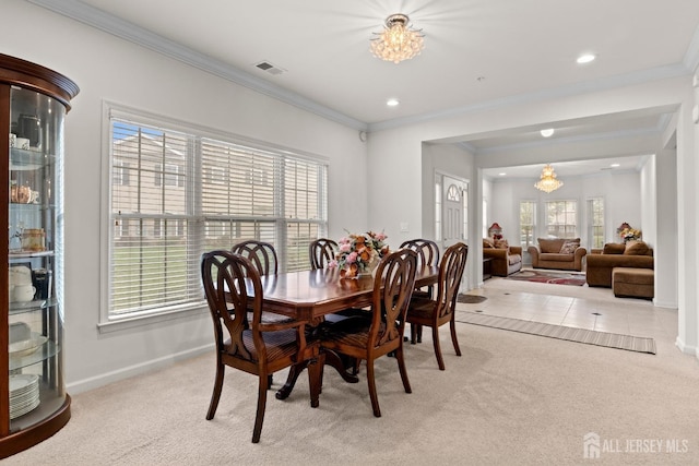 dining area featuring light carpet, ornamental molding, baseboards, and recessed lighting