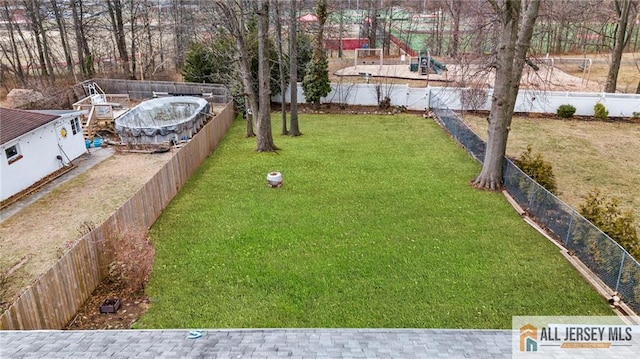 view of yard with a fenced backyard