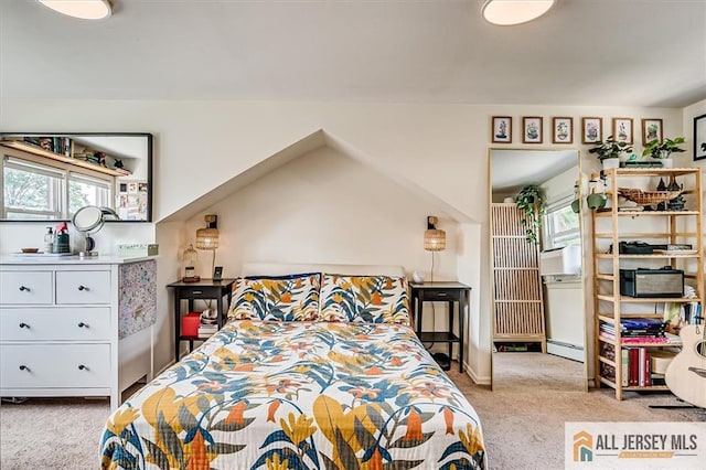 121 E Cliff Rd, Colonia, NJ 07067 - carpeted bedroom featuring multiple windows and a baseboard heating unit