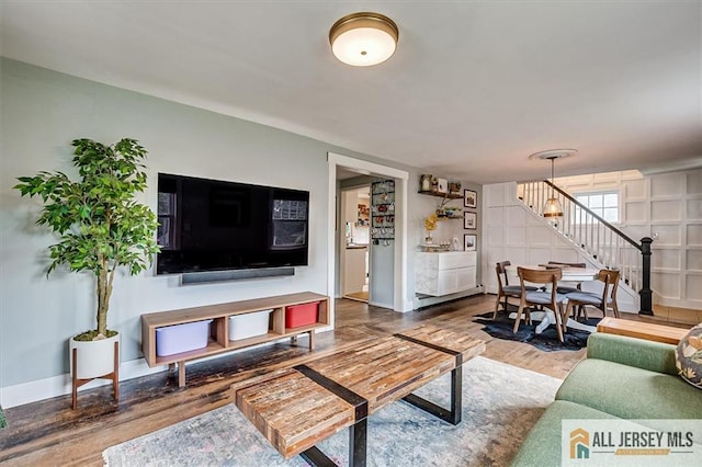 121 E Cliff Rd, Colonia, NJ 07067 - living room with stairway and wood finished floors