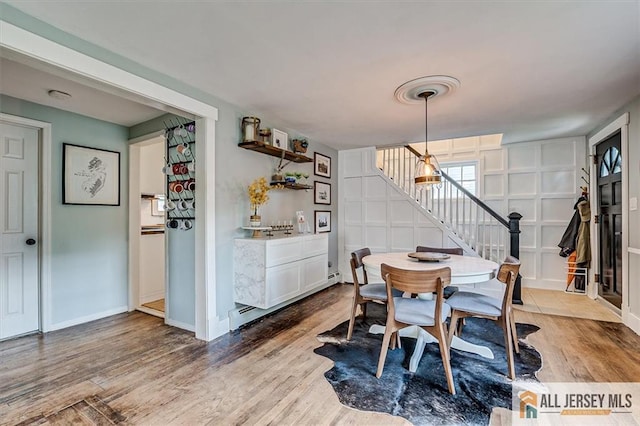 121 E Cliff Rd, Colonia, NJ 07067 - dining space with stairs and wood finished floors