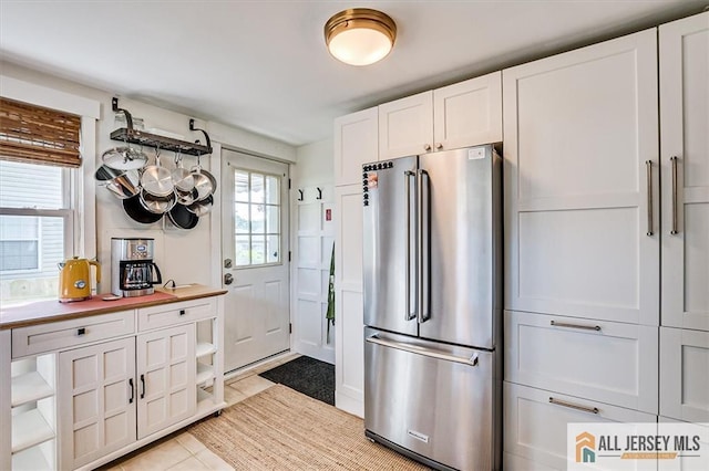 121 E Cliff Rd, Colonia, NJ 07067 - kitchen with high quality fridge, open shelves, and healthy amount of natural light