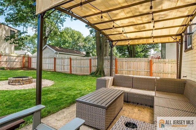 121 E Cliff Rd, Colonia, NJ 07067 - fenced backyard with an outdoor living space with a fire pit and a patio