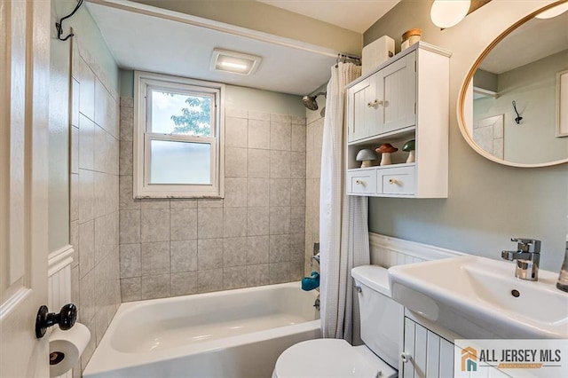 121 E Cliff Rd, Colonia, NJ 07067 - bathroom with shower / bath combo and wainscoting
